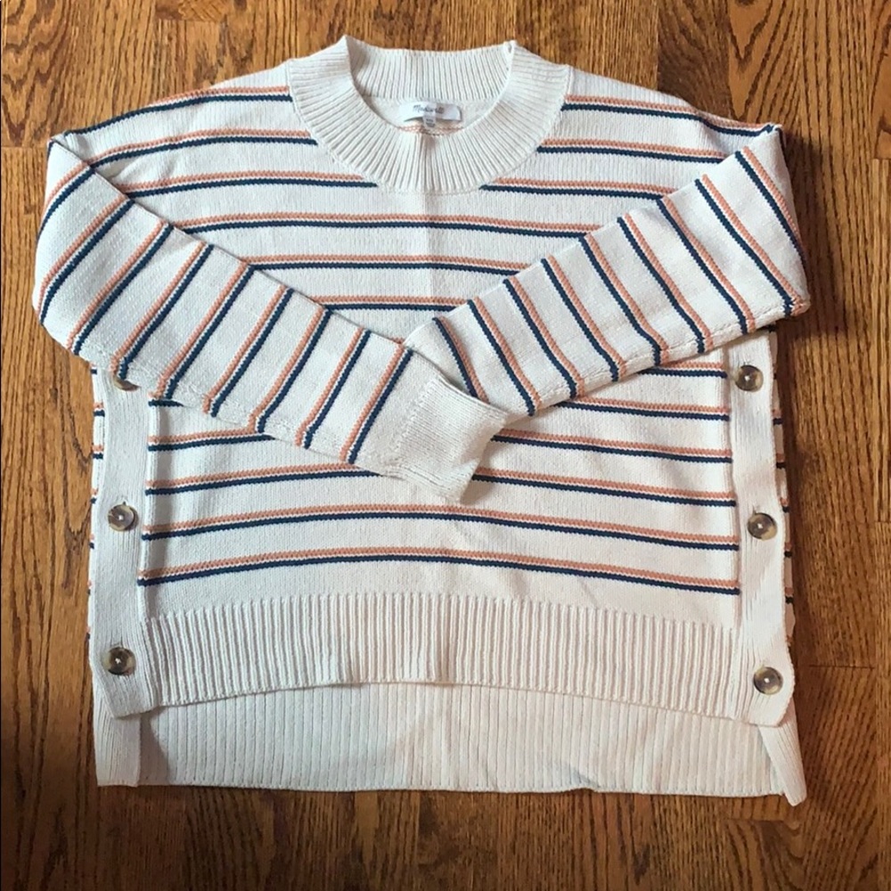 Soft knit with double stripes and button detail.